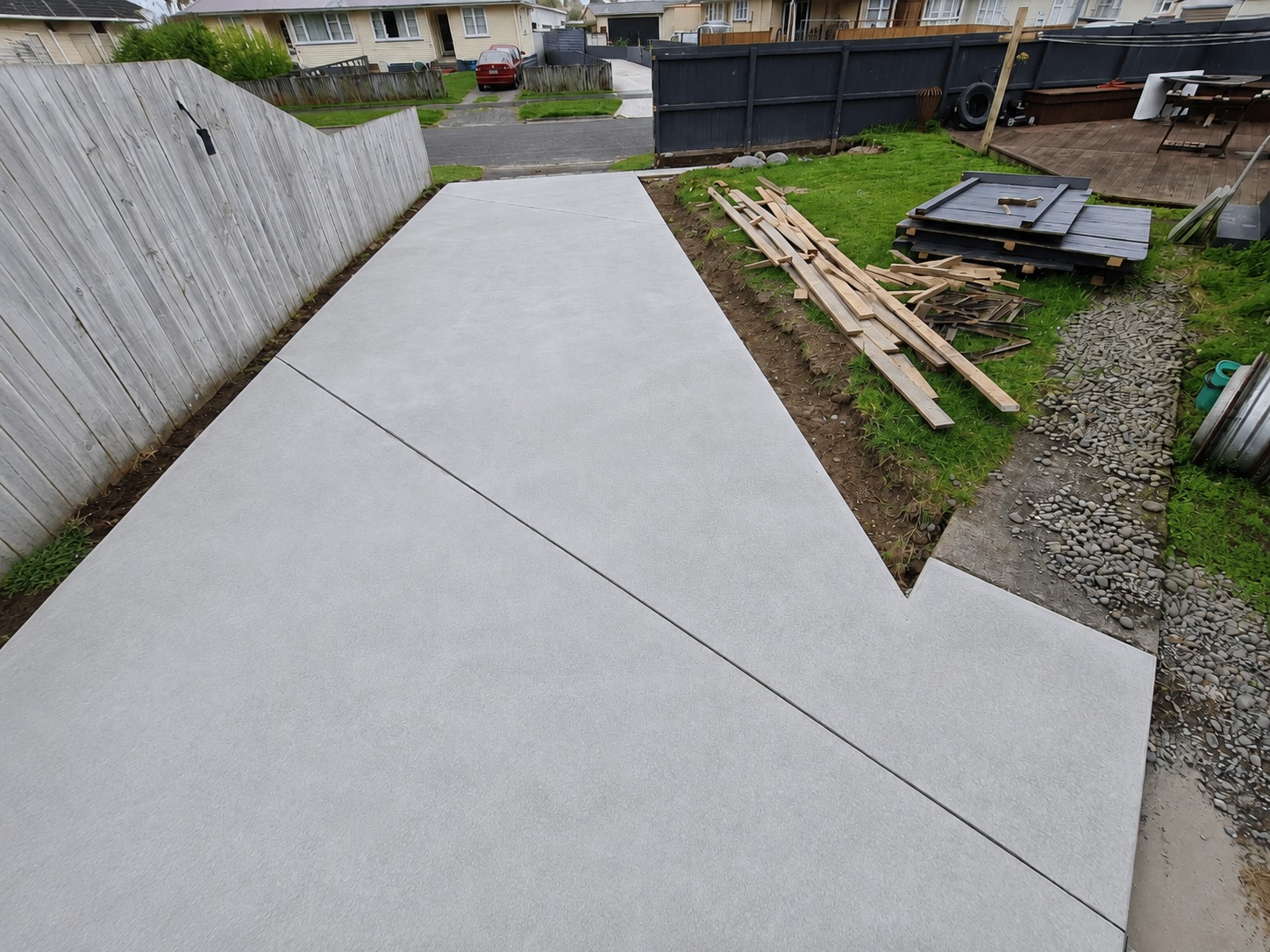 Widened concrete driveway and parking pad at a Hamilton home